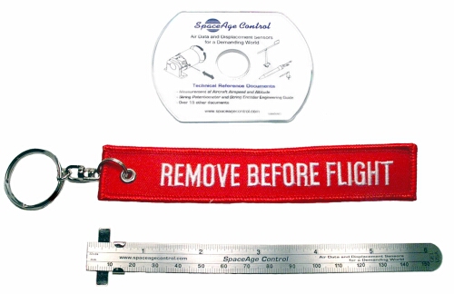 Figure C1 - REMOVE BEFORE FLIGHT keychain, precision-etched 6-inch (150-mm) stainless steel ruler with depth marker and fraction to mm converversion table, and technical reference CD